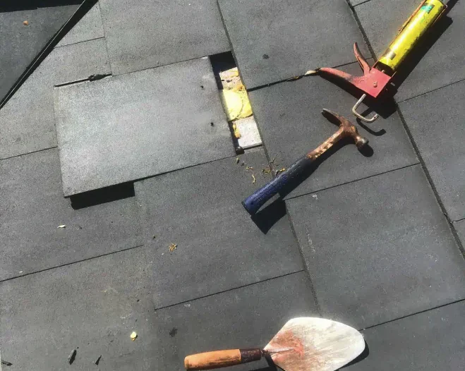 client photo doing roof repair and tools